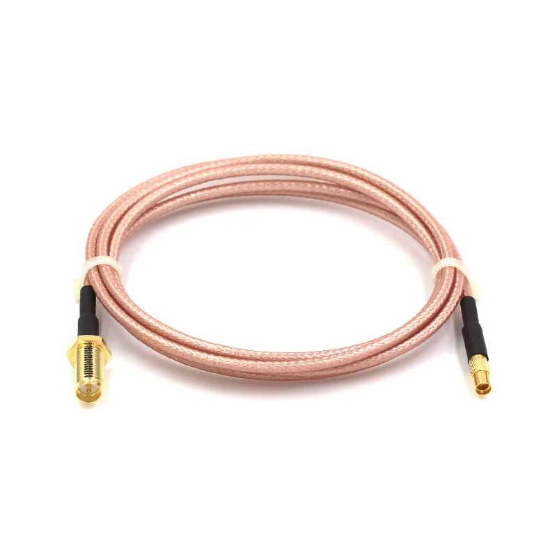 An RP-SMA extension cable connected to the RP-SMA female port of a Wi-Fi router, ready to extend the antenna