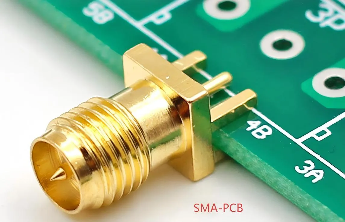 Physical photo of SMA connectors installed on an electronic circuit board