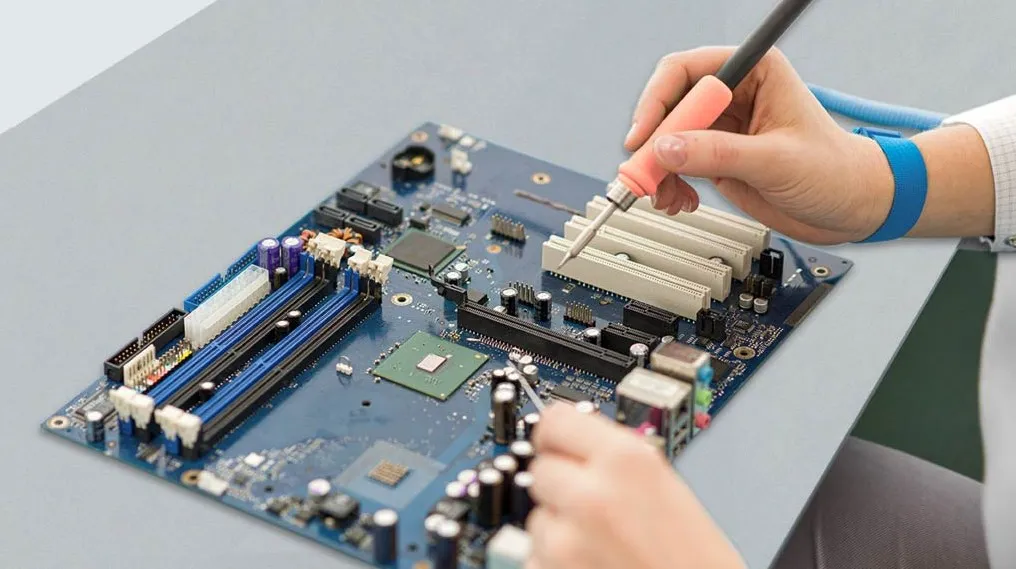 Engineer testing a 5 V MCU board with an ESD gun; PESD5V0S1BAF near the connector with dual ground vias Engineer testing a 5 V MCU board with an ESD gun; PESD5V0S1BAF near the connector with dual ground vias