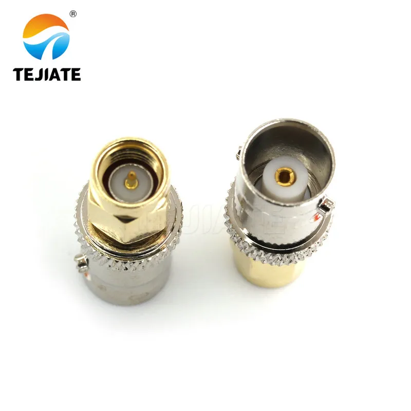 Photo of an inline SMA-F to BNC-M adapter. Photo of an inline SMA-F to BNC-M adapter.