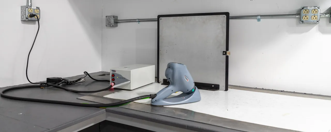 Photo of an ESD gun applying a discharge to a product under test in a lab setting, according to IEC 61000-4-2. Photo of an ESD gun applying a discharge to a product under test in a lab setting, according to IEC 61000-4-2.