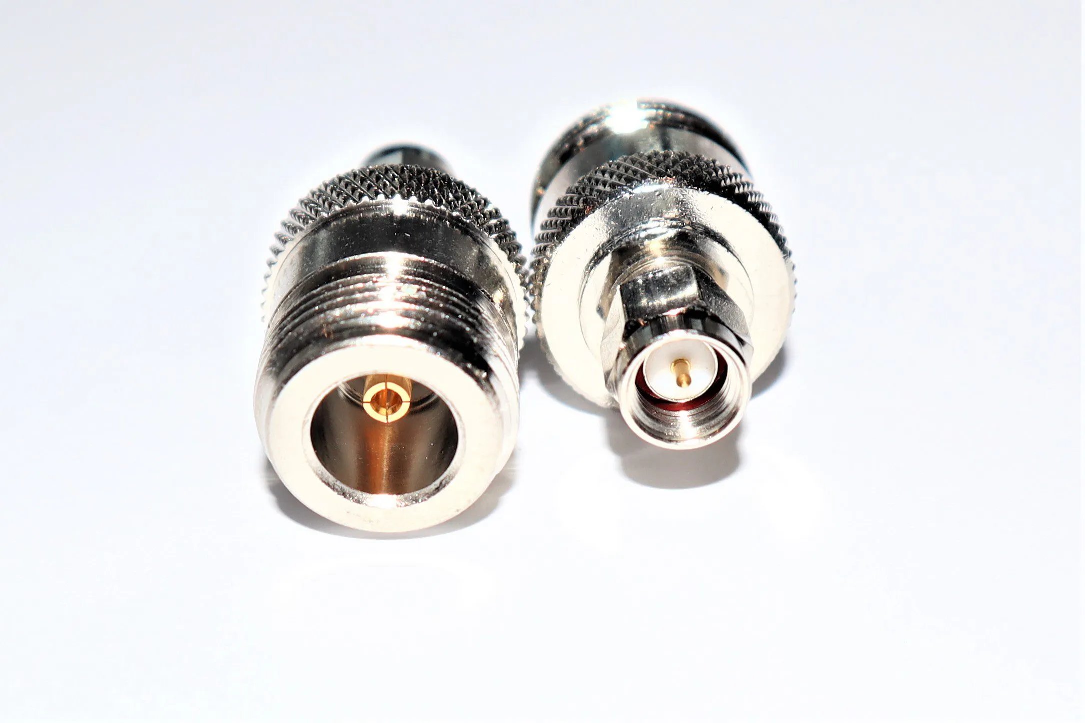Comparison image between a simple SMA to N adapter (for lab use) and a complete, ruggedized SMA to N cable assembly (for field use). Comparison image between a simple SMA to N adapter (for lab use) and a complete, ruggedized SMA to N cable assembly (for field use).