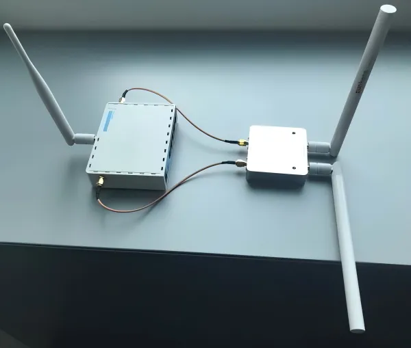A block diagram or exploded view illustrating the RF chain: RF chip -> internal micro-coax -> SMA bulkhead -> external antenna cable -> antenna element. A block diagram or exploded view illustrating the RF chain: RF chip -> internal micro-coax -> SMA bulkhead -> external antenna cable -> antenna element.