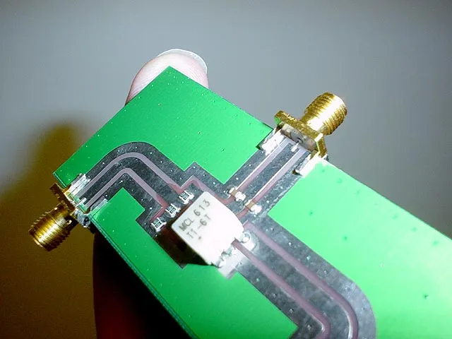 Visual concept of an SMA cable bridging controlled and uncertain RF environments. Visual concept of an SMA cable bridging controlled and uncertain RF environments.