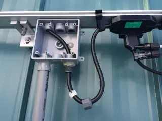 A detailed schematic showing proper protection for outdoor-installed 75 ohm BNC cable: a UV-resistant jacket, a sealed BNC connector, and a drip loop formed above the connection point. A detailed schematic showing proper protection for outdoor-installed 75 ohm BNC cable: a UV-resistant jacket, a sealed BNC connector, and a drip loop formed above the connection point.