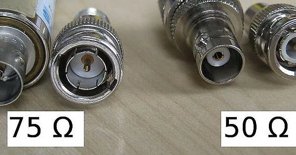 Side-by-side comparison of 50-ohm and 75-ohm coaxial cables, highlighting subtle differences in construction Side-by-side comparison of 50-ohm and 75-ohm coaxial cables, highlighting subtle differences in construction