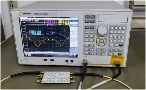 Diagram showing a BNC to SMA adapter connecting a BNC instrument to an SMA device on a workbench Diagram showing a BNC to SMA adapter connecting a BNC instrument to an SMA device on a workbench