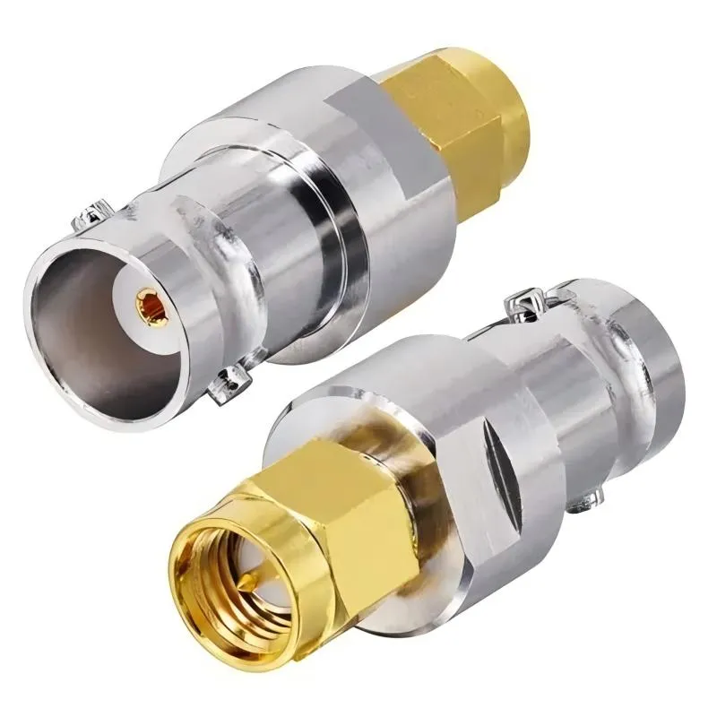 Photograph of a rigid BNC to SMA adapter, a short metal body with BNC on one end and SMA on the other Photograph of a rigid BNC to SMA adapter, a short metal body with BNC on one end and SMA on the other