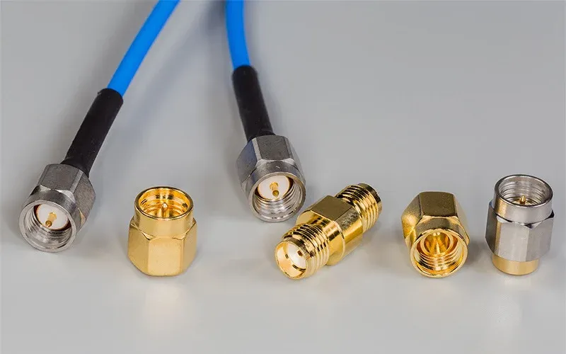 Side-by-side comparison of a rigid adapter and a flexible SMA adapter cable, showing mechanical differences Side-by-side comparison of a rigid adapter and a flexible SMA adapter cable, showing mechanical differences