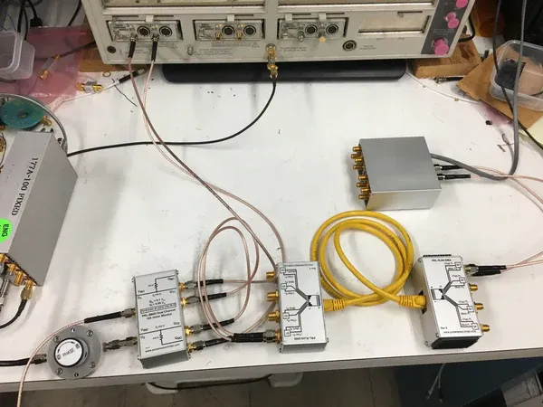 Diagram showing an SMA adapter cable appearing late in the design process to solve a connector mismatch Diagram showing an SMA adapter cable appearing late in the design process to solve a connector mismatch