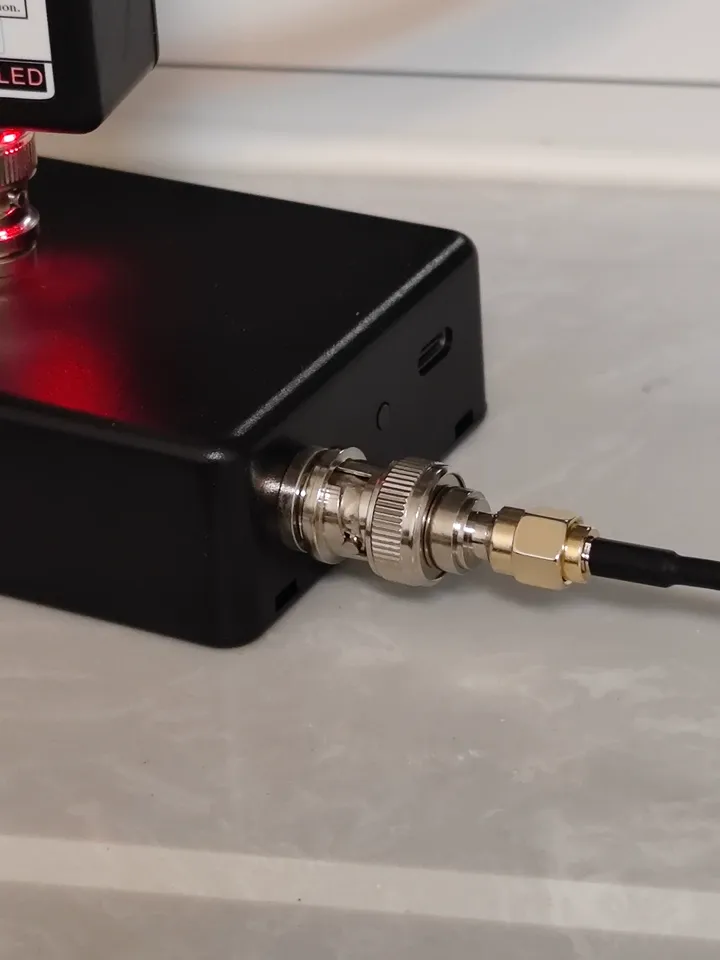 A typical SMA to BNC adapter connecting an SMA device to a BNC instrument A typical SMA to BNC adapter connecting an SMA device to a BNC instrument