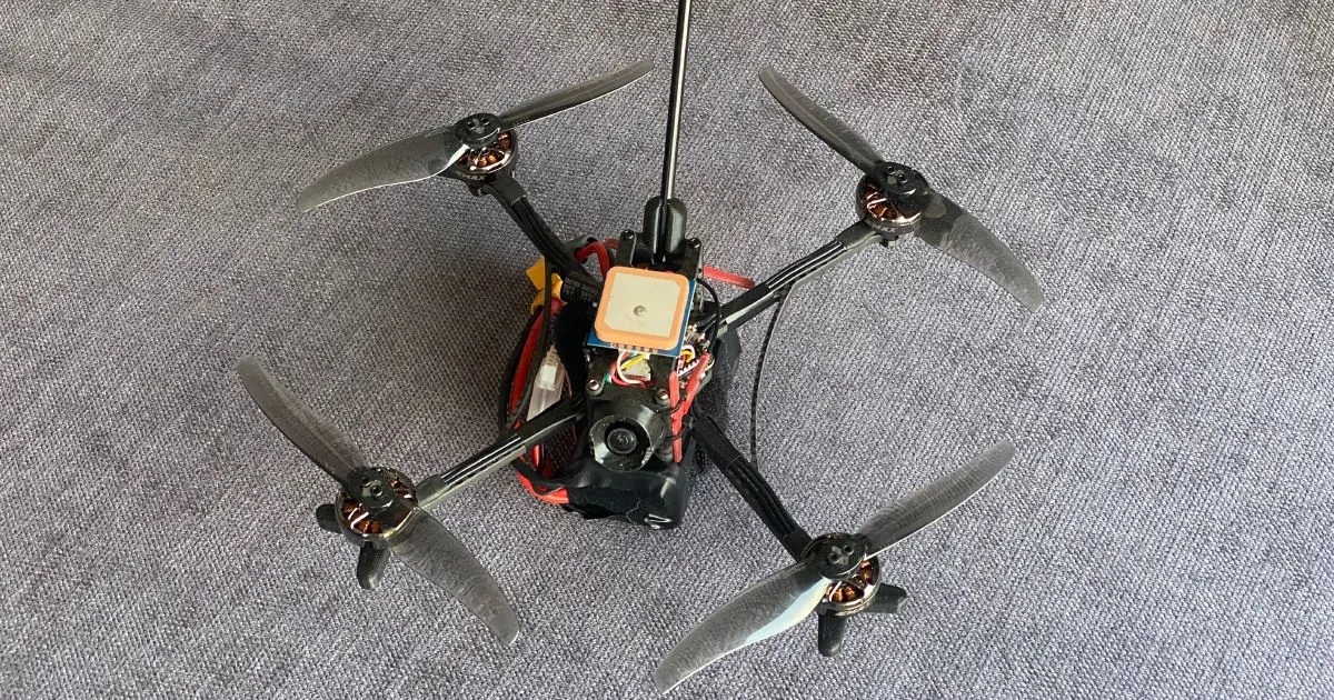 Small FPV drone after a crash, with a bent antenna and damaged connector, highlighting the need for durable LHCP designs Small FPV drone after a crash, with a bent antenna and damaged connector, highlighting the need for durable LHCP designs