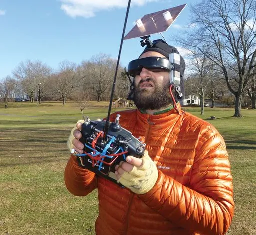 Multiple FPV drones flying in a shared field with RHCP signal waves overlapping, causing interference Multiple FPV drones flying in a shared field with RHCP signal waves overlapping, causing interference