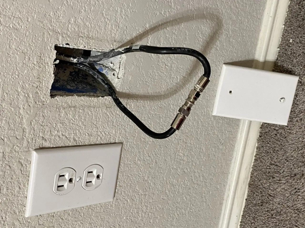 A coaxial splitter placed on a lab bench, appearing harmless and simple A coaxial splitter placed on a lab bench, appearing harmless and simple