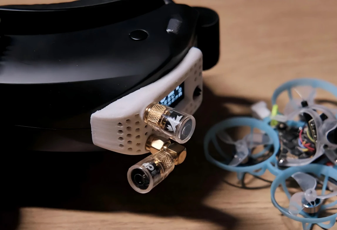 FPV goggles with dual receiver antennas and small drone FPV goggles with dual receiver antennas and small drone