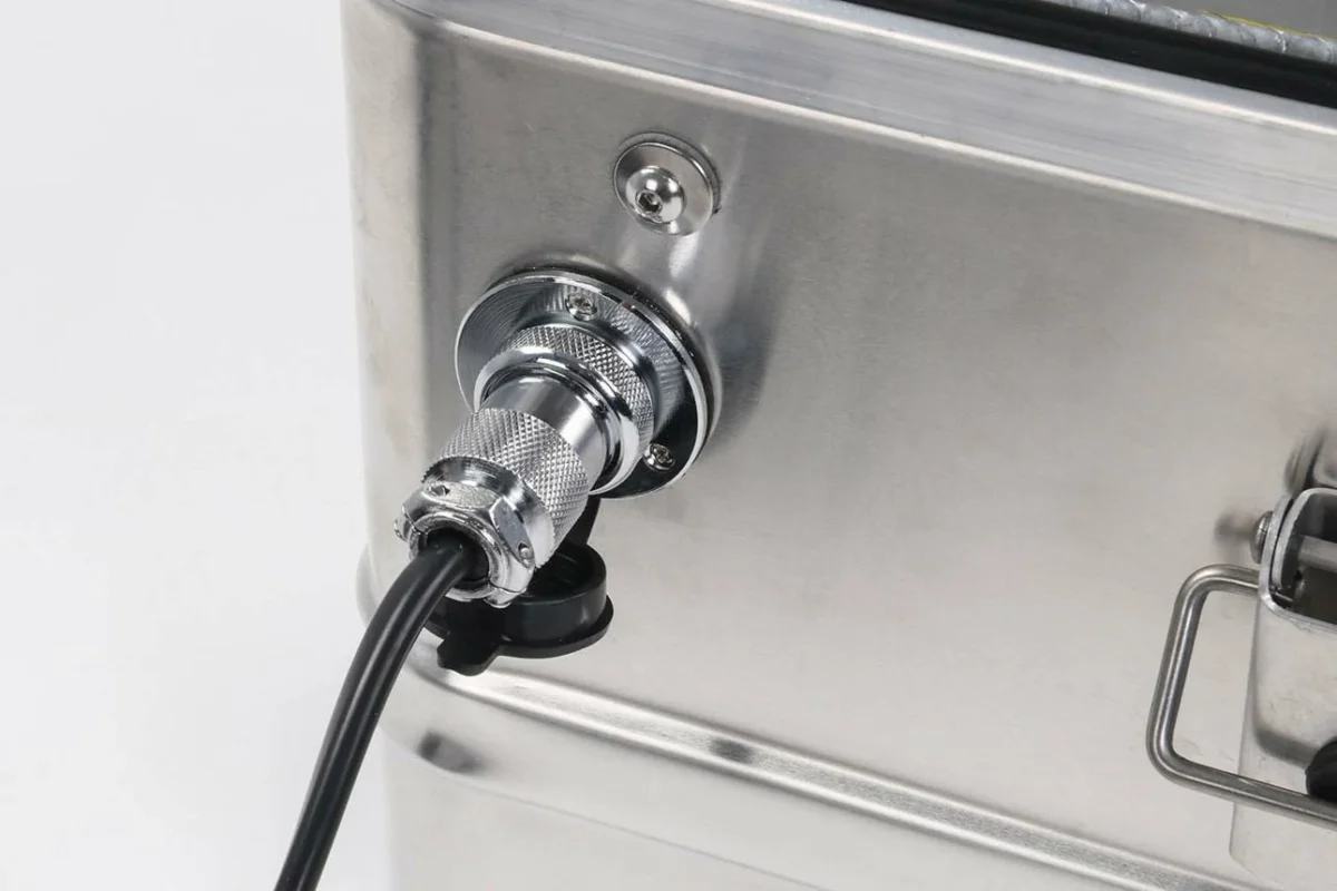 Panel-mounted GX16 circular connector connected to an industrial machine cable Panel-mounted GX16 circular connector connected to an industrial machine cable
