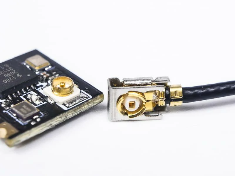 IPEX micro coax cable connector beside PCB-mounted RF socket IPEX micro coax cable connector beside PCB-mounted RF socket