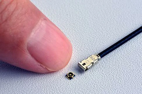 Miniature IPEX connector size compared with a fingertip Miniature IPEX connector size compared with a fingertip