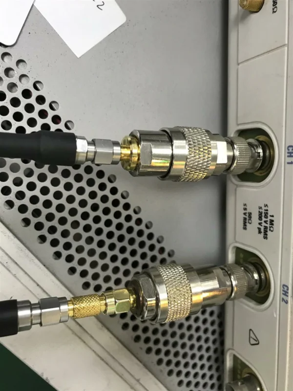 RF coaxial adapters connected to BNC ports on electronic test equipment RF coaxial adapters connected to BNC ports on electronic test equipment