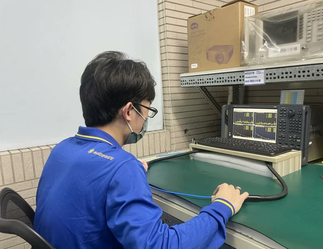 Engineer testing RF cable assembly return loss with a VNA Engineer testing RF cable assembly return loss with a VNA