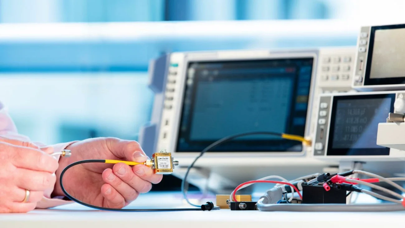 RF component connected to a coaxial test cable during laboratory measurement RF component connected to a coaxial test cable during laboratory measurement