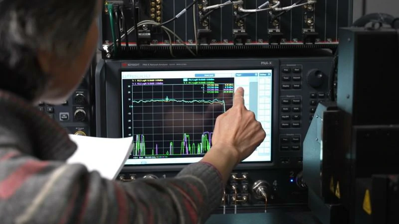RF engineer performing VNA S parameter testing on an RF cable assembly RF engineer performing VNA S parameter testing on an RF cable assembly