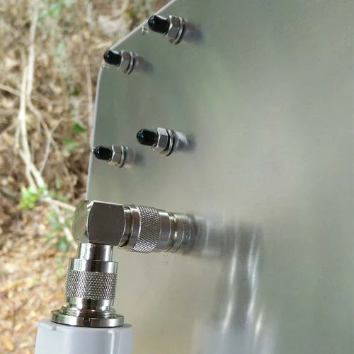 Right-angle RF adapter mounted on an outdoor equipment panel Right-angle RF adapter mounted on an outdoor equipment panel