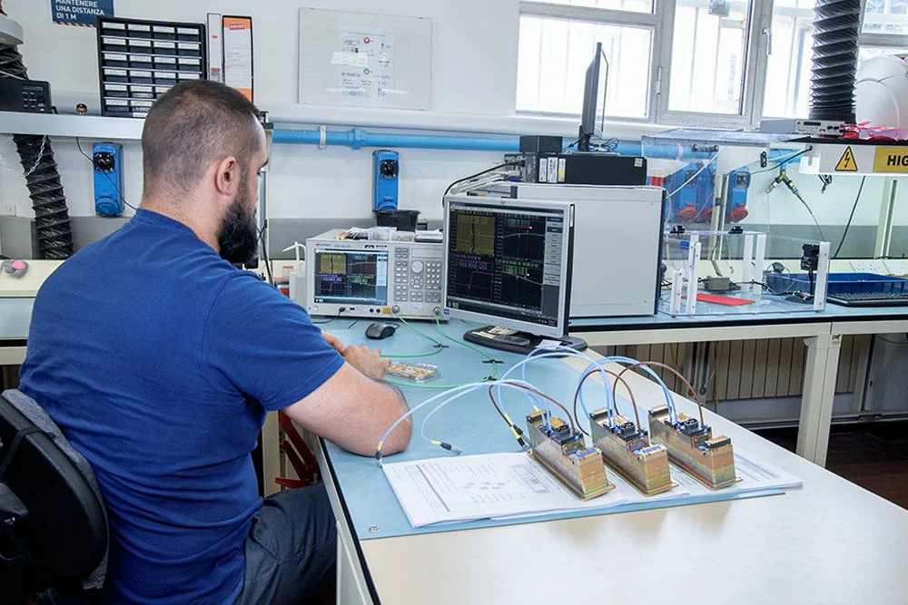 RF engineer testing cable assembly performance with VSWR measurement equipment RF engineer testing cable assembly performance with VSWR measurement equipment