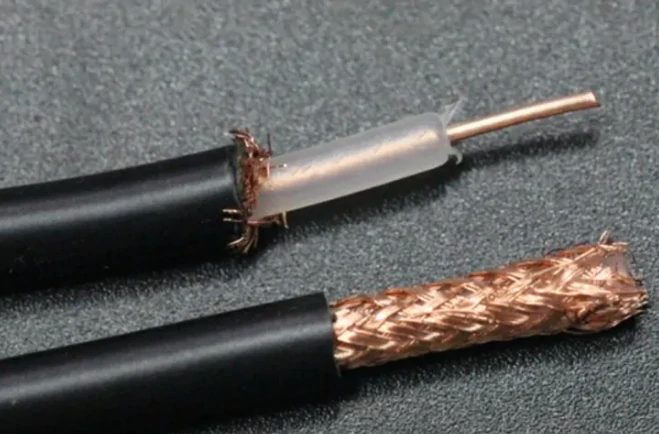 Stripped coax cable showing center conductor dielectric insulation and copper braided shield Stripped coax cable showing center conductor dielectric insulation and copper braided shield
