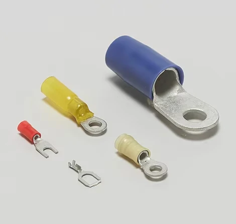 Close up view of copper ring terminal connector with insulated sleeve for wire crimping Close up view of copper ring terminal connector with insulated sleeve for wire crimping