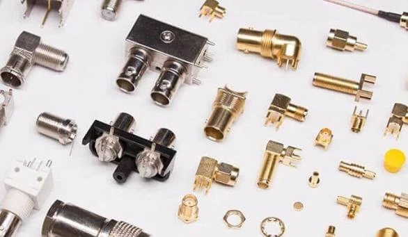 Assortment of RF coaxial connectors, right-angle adapters, PCB connectors, and panel-mount components Assortment of RF coaxial connectors, right-angle adapters, PCB connectors, and panel-mount components