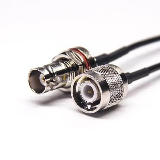 Close-up of RF coaxial cable connectors showing bayonet and threaded interfaces for adapter selection Close-up of RF coaxial cable connectors showing bayonet and threaded interfaces for adapter selection