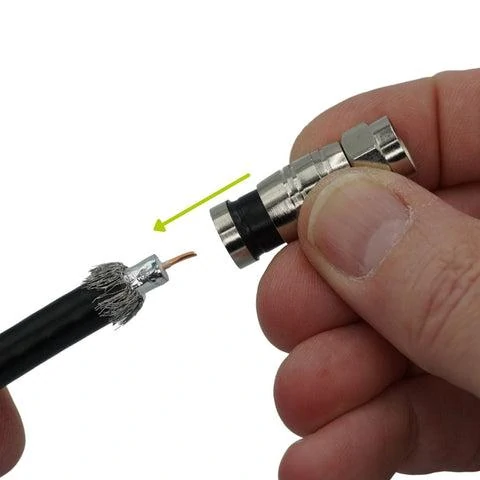 Prepared RG6 coax cable aligned with a compression connector before installation Prepared RG6 coax cable aligned with a compression connector before installation