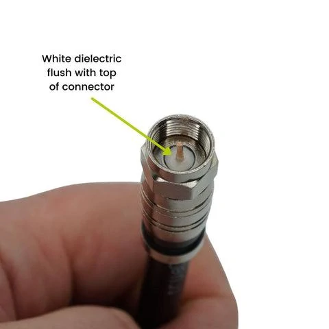 Close-up of an installed RG6 F connector showing the white dielectric flush with the connector top Close-up of an installed RG6 F connector showing the white dielectric flush with the connector top