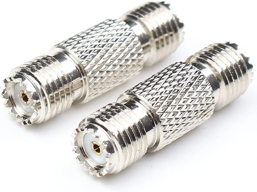 Two UHF female-to-female barrel adapters with SO-239 connector interfaces Two UHF female-to-female barrel adapters with SO-239 connector interfaces