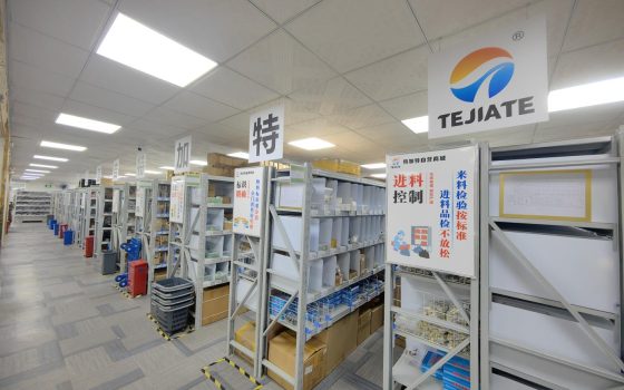 TEJTE warehouse shelves with labeled racks and incoming inspection signage, neatly stored RF parts.